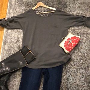 Grey roll up sleeve sweater.